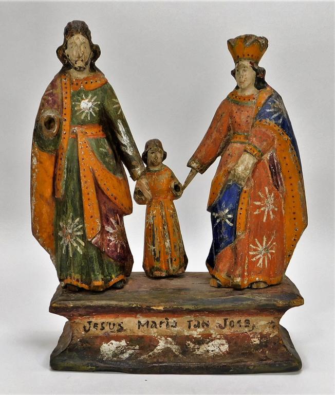 Antique Latin American Polychrome Icon Carving: Mexico, Latin America,Circa 19th-20th Century Folk art carving of Mary, Joseph, and Jesus as a child, dressed in vibrantly colored clothing. Figures can be removed from the base. Wood, paint,12" x 9",
