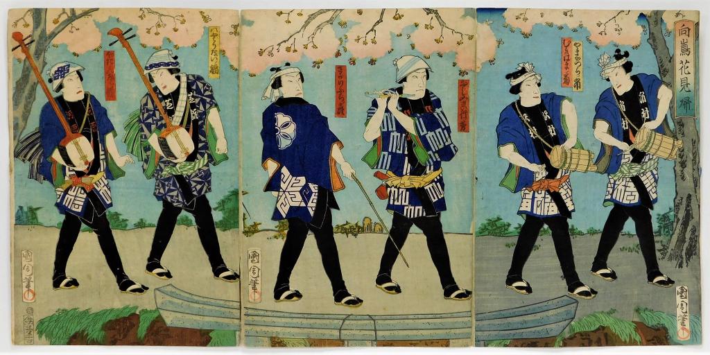 Japanese Parading Musicians Woodblock Triptych: Japan,Meiji Period Ukiyo-e print depicting five men dressed in blue and white playing various instruments while walking beneath cherry blossom trees. Woodblock and color on paper,Overall 14" x 28 1/2"