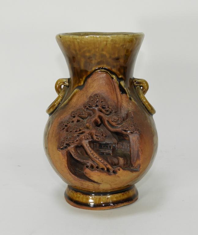 Japanese Sumida Gawa Earthenware Pottery Vase: Japan,20th Century Archaic form with molded ring handles decorated with a carved and molded mountainous village with openwork cherry blossom tree, finished in a mottled brown glaze. Earthenware,7 1/8"