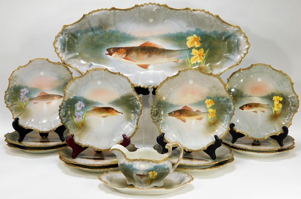 15PC French Limoges Porcelain Fish Dinnerware Set: France,Early 20th Century Includes one serving plate, gravy boat with saucer, and twelve dinner plates decorated with various species of fish.Porcelain,Smallest 4 1/2" x 7",Largest 24" longEach marked