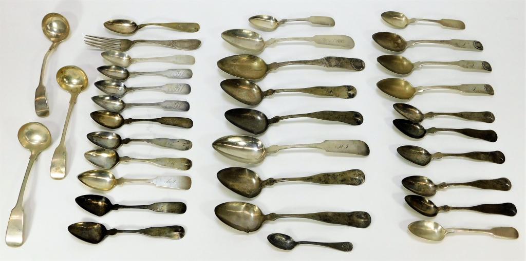 44PC American Coin Silver Tableware Grouping: United States,Early 20th Century Includes one fork, three ladles, nine serving spoons, nineteen spoons, one large serving spoon, and one small Old Grist Mill Wheat Coffee commemorative spoon. Weight a
