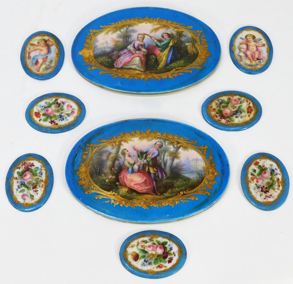 9 French Sevres Type Enameled Porcelain Cartouches: France,19th Century Five cartouches decorated with bouquets of flowers, two decorated with cherubic puti, and two decorated with romantic courting scenes of a noble couple. Porcelain,Smallest 2" x 1 1