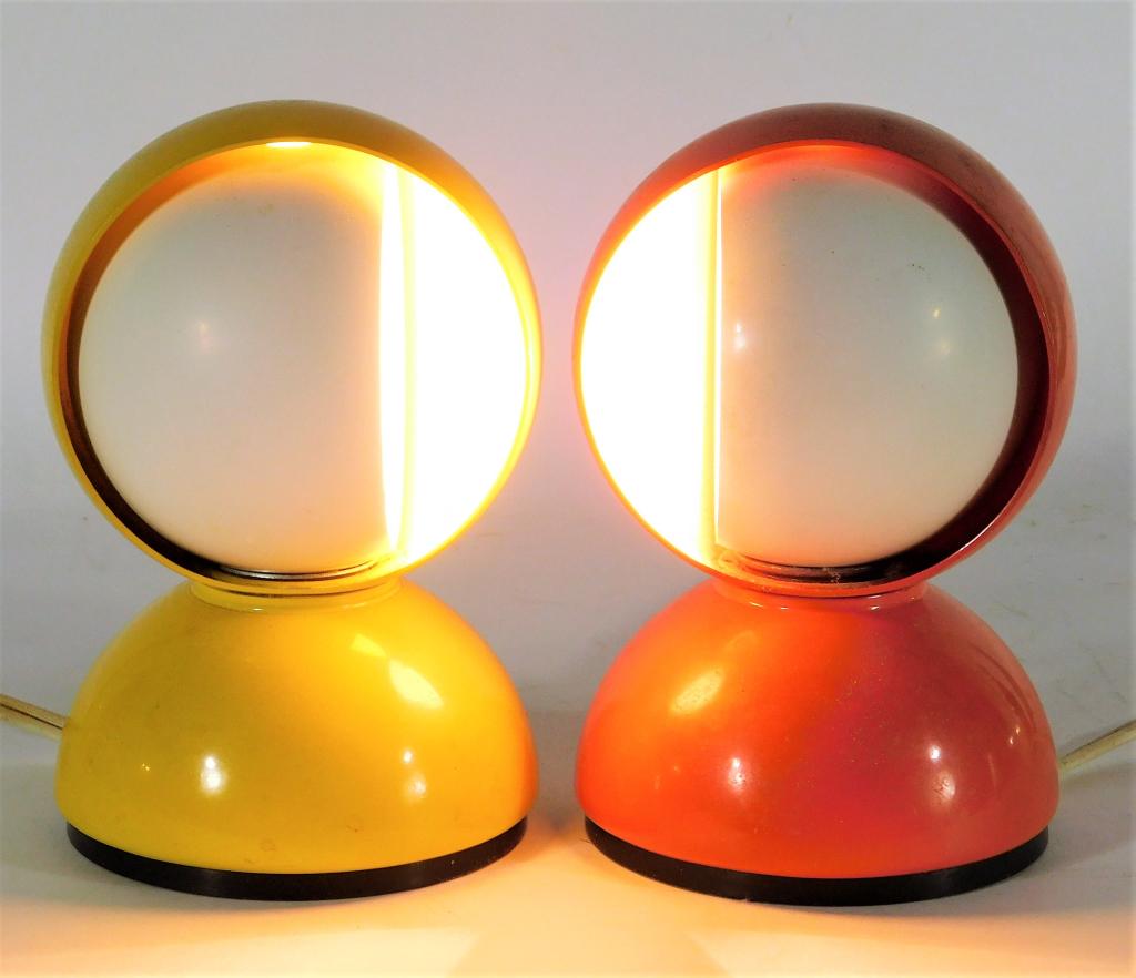PR Vico Magistretti Eclisse Rotating Table Lamps: Vico Magistretti Italy,1920-2006 Two squat bulbous metal lamps with mobile white enameled inner shades for difussed light. One lamp is a vibrant orange, the other is buttercup yellow. Aluminum,7" x 4 