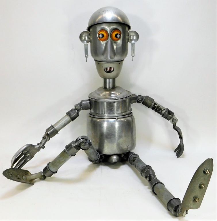 Jim Bauer Found Object Robot Sculpture: United States,20th Century Metal man made up of common house hold objects like table spoons and gardening supplies. Jim Bauer creates whimsical robots out of everyday supplies. Aluminum, steel, plasti