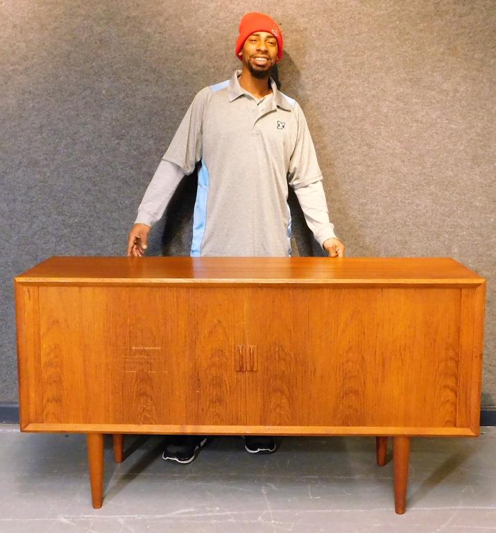 MCM Danish Sliding Tambour Stereo Console Table: Denmark,20th Century Rectangular top table over two tambour doors opening to reveal eight compartments supported by four tapered legs. Wood,31 1/2" t x 59" w x 19" d, From the collection of an East Pr