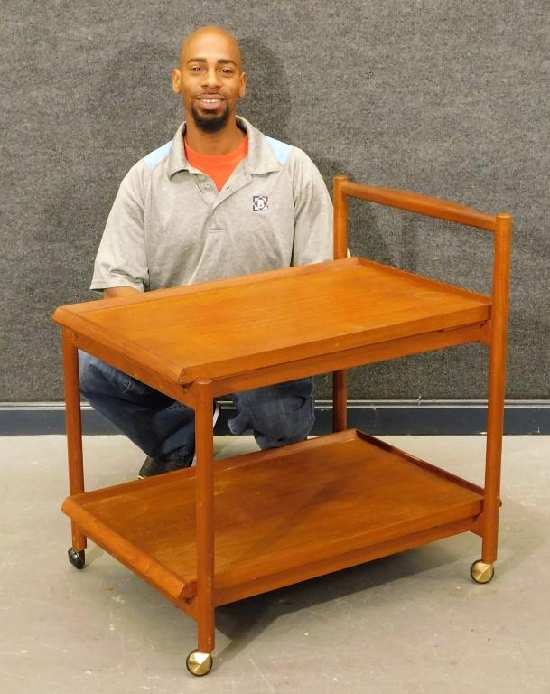Mobelfabrik Norwegian Wood Tea Service Cart: Norway,20th Century Removable rectangular top over one rectangular shelf supported by four simple legs on wheels. Wood,22 1/2" t x 29 1/2" w x 21" d,Height to top of handle 29" Marked "Norway" and "Mo