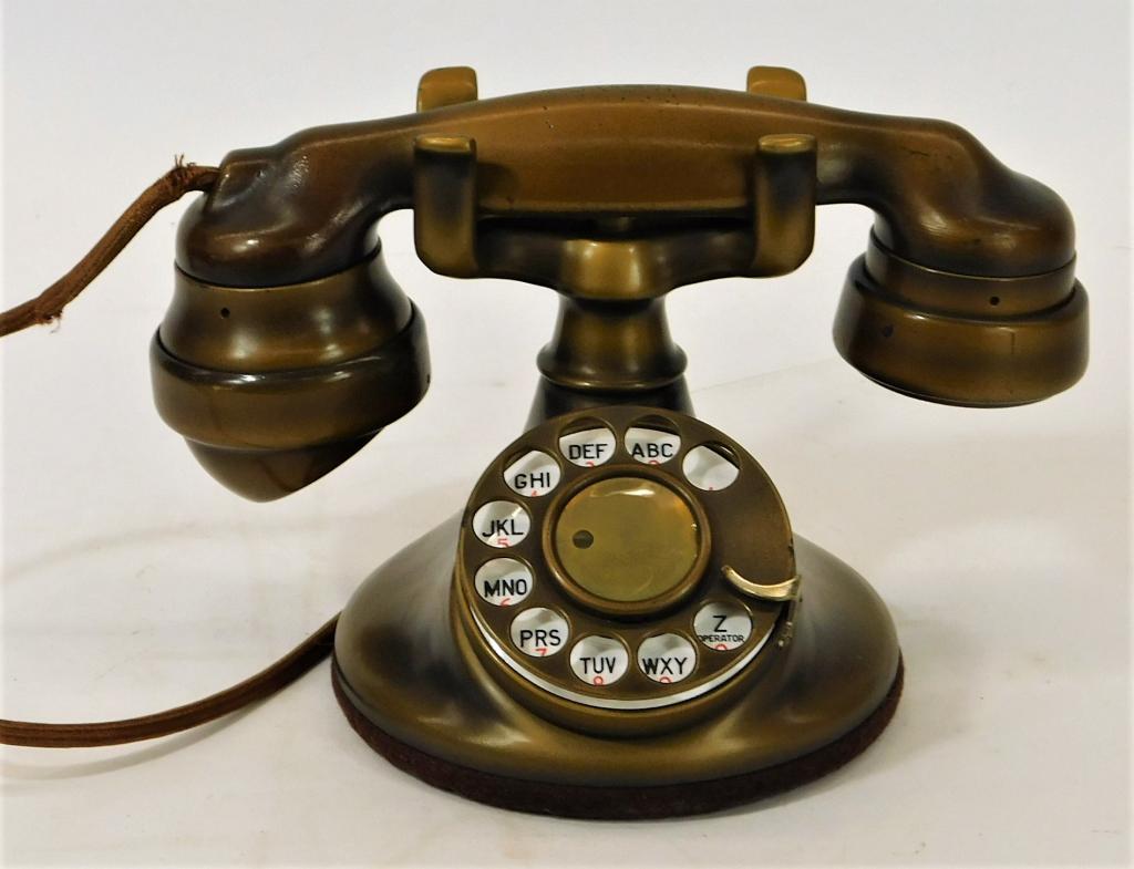 Western Electric Model B1 Bronzed Cradle Telephone: United States,1930's Rotary style phone with an E1 style handset with antique bronzed paint and matching fabric covered chord. Metal, plastic,Overall 5 1/2" x 9", Handset marked "Western Electric. Fro