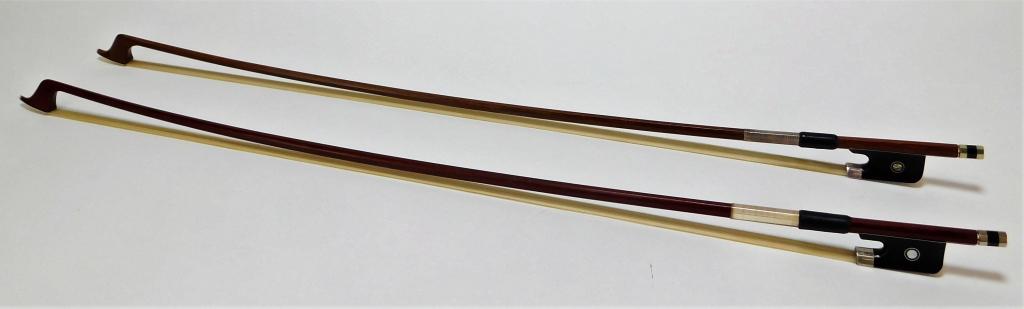 2 American Full Size Horse Hair Cello Bows: United States,20th Century Includes two cello bows with ebony frogs, inlaid mother of pearl Parisian eyes and buttons.Wood, horsehair, metal, MOP,28",From the collection of a Manhattan, New York gentl
