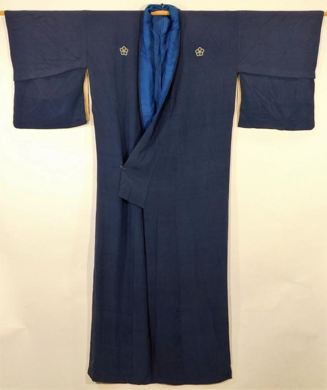 Japanese Five Crested Indigo Tomesode Kimono: Japan,19-20th Century Light blue tightly woven chirimen silk with five cherry blossom shaped mons and two different shades of blue for the lining. 55" length x 24" across body x 48" wingspan Silk,, Fr