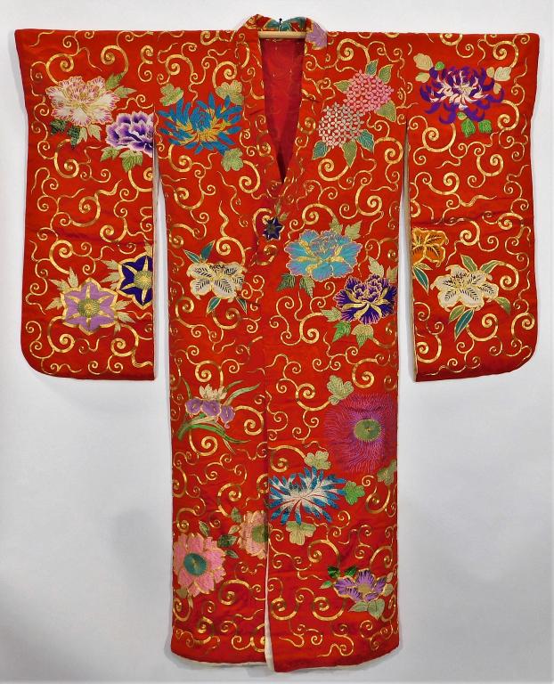 Japanese Edo Period Red and Gold Uchikake Kimono: Japan,Circa 1840 Partially lined hand woven red silk damask with navy and blue flower and leaf applique and vibrant gold couching. 52" wingspan x 25 1/2" body x 63" length Silk, gold thread,, Immacula