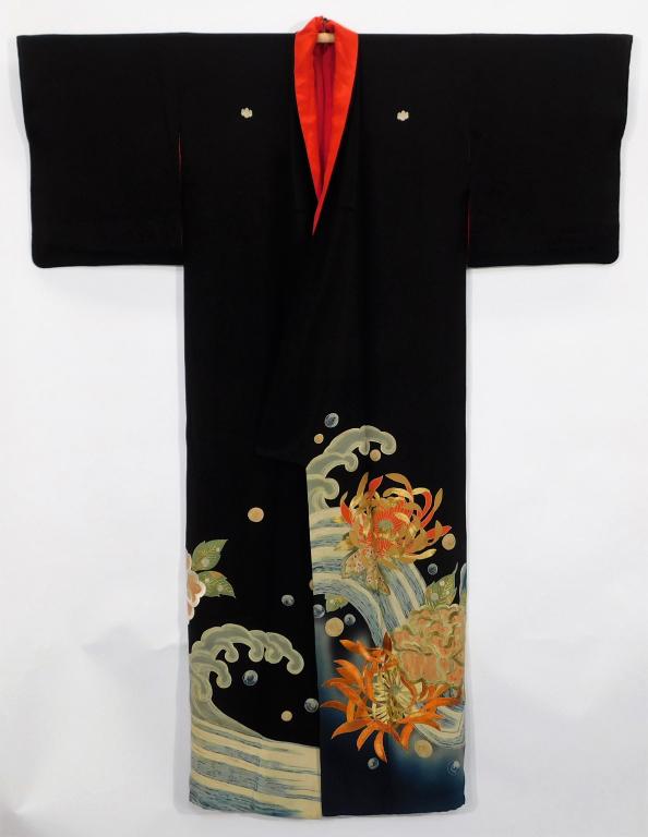 Japanese Meiji Period Floral Waves Tomesode Kimono: Japan,Circa 1890 Hand woven black silk crepe five crested kimono with hand painted yuzen dye flowers against a crested wave, embroidery, and gold couching. 51" wingspan x 25 1/2" across x 63" length S