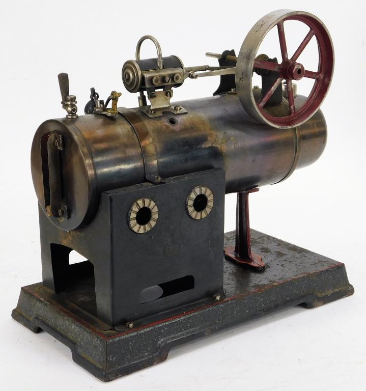 Antique Falk Overtype No. 458 Steam Engine: Germany,Early 20th Century Horizontal engine missing burner, oxidation all along base, shows some use around the boiler, retains most of original paint. Metal,9" t x 9 1/2" w x 5" d, Marked "JF" on si