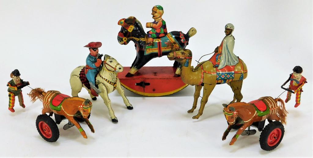 5PC German and Japanese Tin Wind Up Toy Group: Germany, Japan,Early 20th Century Includes one GAMA Germany Clown riding a horse, one German camel, two horses pulling clowns, and one Japanese cowboy on a horse. Tin litho,Smallest 3 3/4" t x 3" w x 