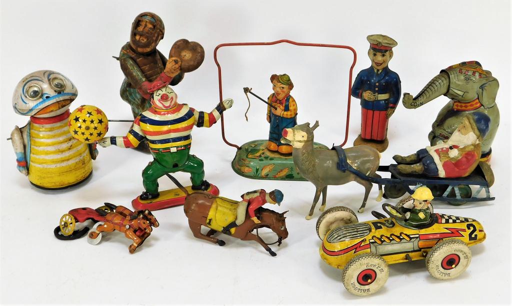 10PC Antique J. Chein T.P.S. Wind Up Tin Toys: United States, Japan, Germany,Early 20th Century Includes one wind up baseball monkey catcher, one chariot, one wind up horse and jockey, one wind up juggling clown, one wind up Santa riding in a bell