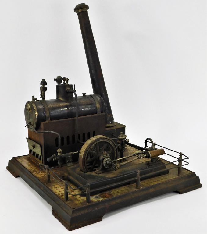 German Ernst Plank Horizontal Steam Engine: Germany,Early 20th Century Large variation with rusting throughout, chimney slightly unstable, missing burner, tile pattern worn from oxidation and applied heat from furnace. Metal,16" t x 12 1/2" w x