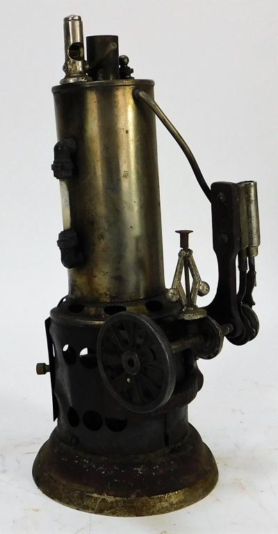 Antique Weeden No 55. Upright Steam Engine: United States,Early 20th Century Vertical engine with single flywheel and original burner, exhibits oxidation and boiler leans to one side. Metal,8 1/2" t x 3 1/2" w x 4 1/4" d, Marked "Weeden No. 55"