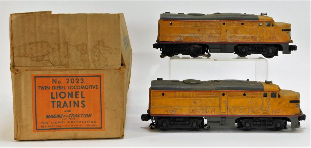 Lionel No. 2023 Union Pacific Train Cars with Box: United States,20th Century Includes two Union Pacific O gauge twin diesel trains with wear and some losses to the paint, untested with original box. Box displays some water stains, tear to one seam, a