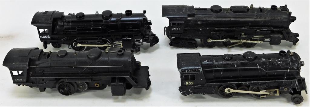 4 Antique Lionel Locomotives: United States,Early 20th Century Includes one No. 999, one No. 1684, one No. 8602, and one No. 2055, all with minor losses to paint, especially to the No. 909, and light oxidation. Untested, standard