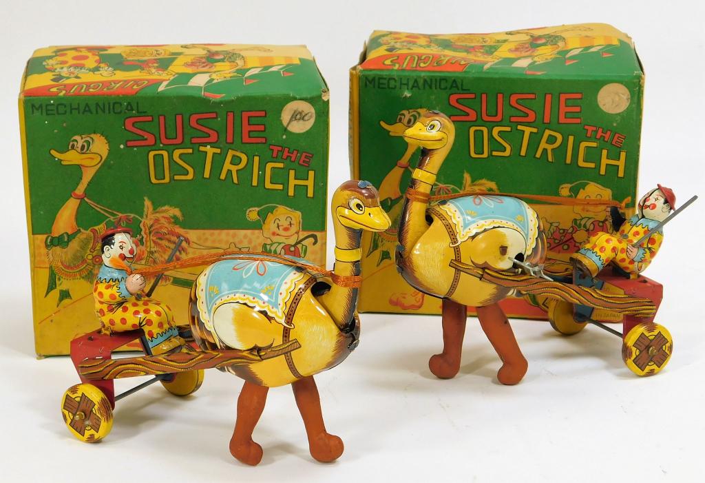 PR Susie the Ostrich Tin Toy with Original Boxes: Japan,Circa 1960 Both wind up but do not walk when put on a table, each with some marks and discoloration to the ostrich legs, very light wear to lithography, but overall display well. One box has on 