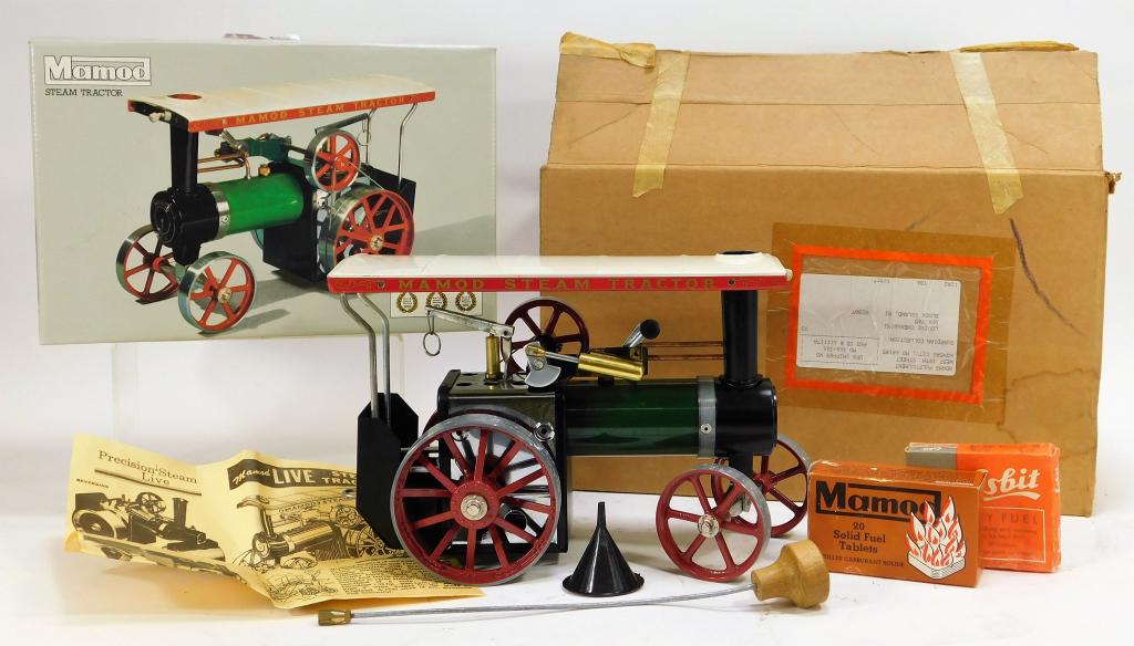 Mamod Steam Tractor with Original Box: United Kingdom,20th Century White residue on wheels, minor wear to roof, with all original lithography and color, box with light wear to the back, minor wear to the edges, tear to top of box at pull t