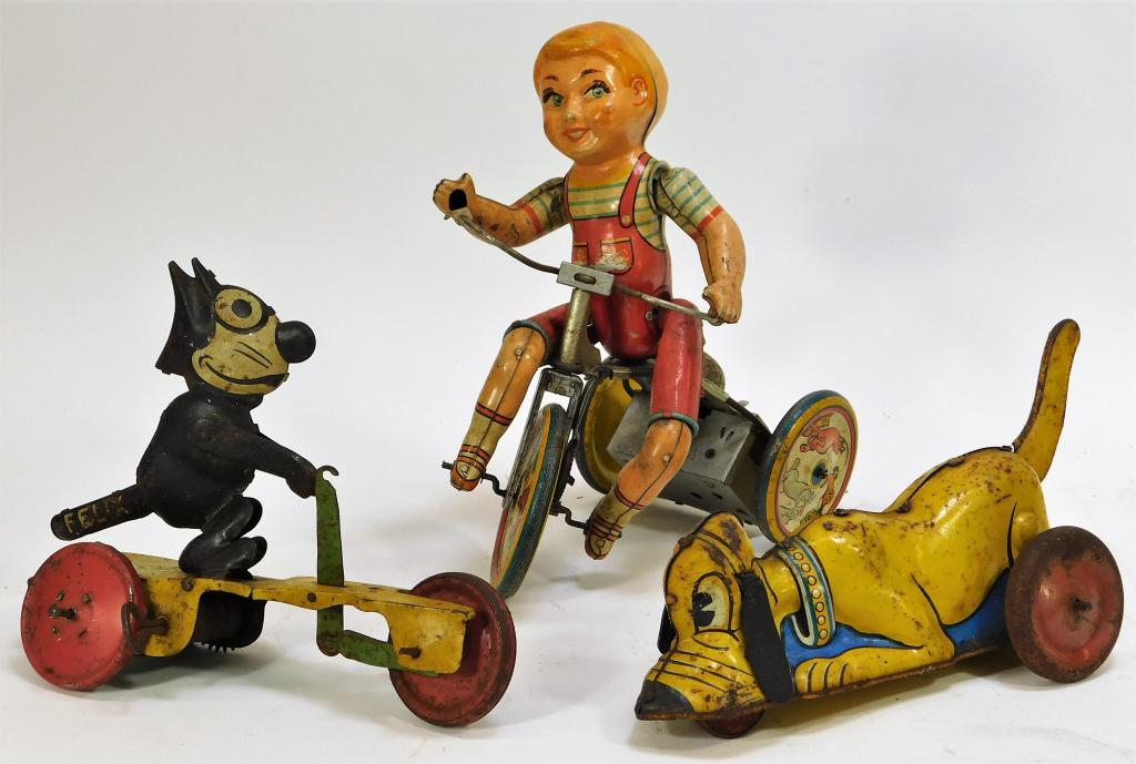 3 German and American Wind-up Tin Toys: Germany, United States,Early 20th Century Includes one German Felix the cat riding a scooter windup toy missing one wheel with oxidation throughout and missing handlebars, does not wind, one Marx pump