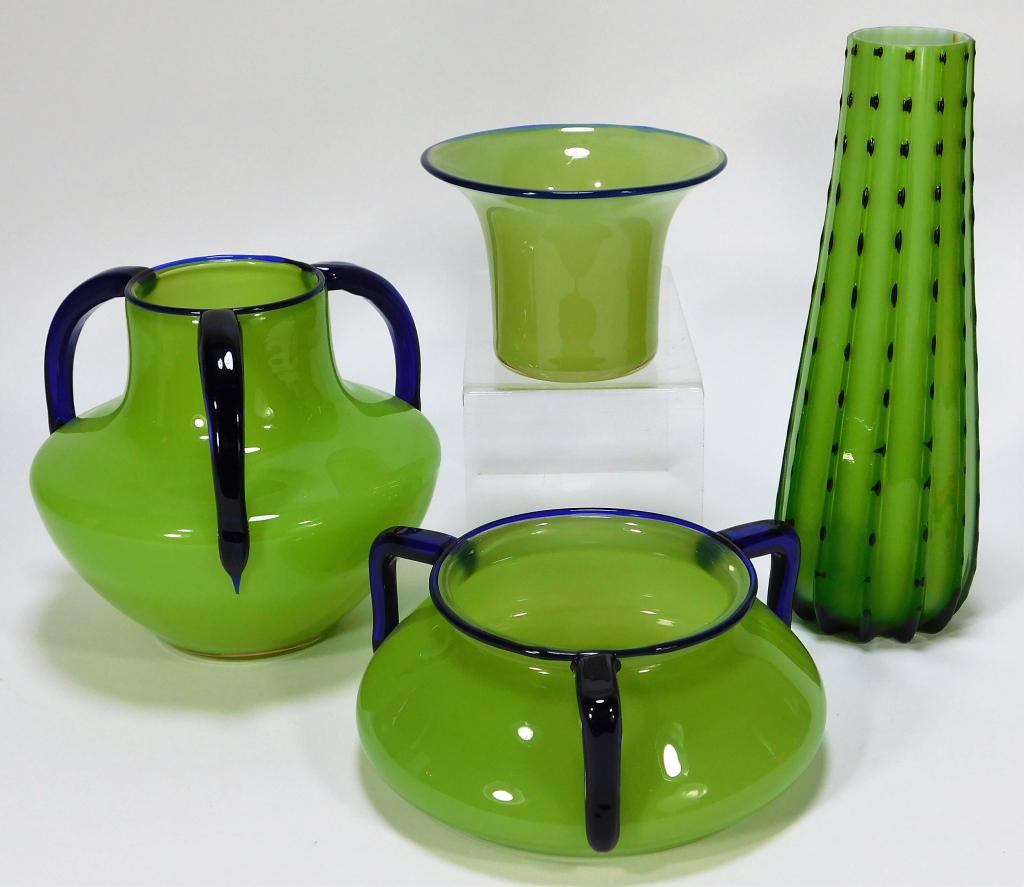 4 Green Tango Bohemian Czech Art Glass Vases: Bohemia,Early 20th Century Includes one urchin cactus vase, one squat vase, and two Michael Polowny for Loetz handled vases. Glass,Smallest 3 1/2" x 5" dia.,Largest 10" x 3" dia. Urchin vase marked "M