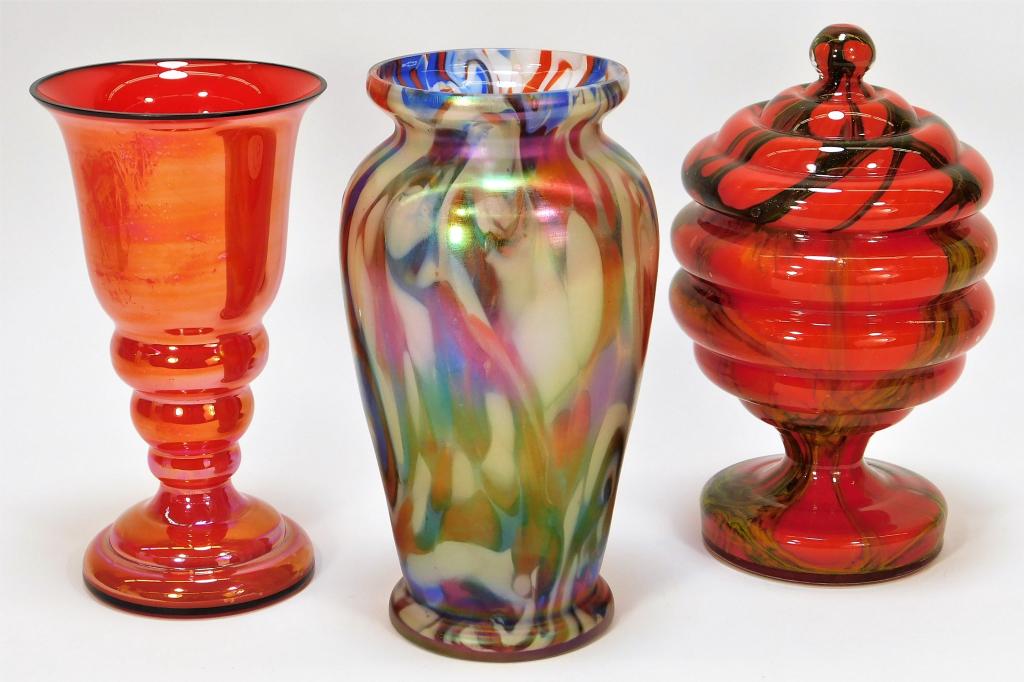 3 Assorted Bohemian Czech Art Glass Vase Jar Group: Bohemia,Early 20th Century Includes one Welz iridescent vase with red, white and blue swirls, one Ruckl covered beehive bowl with green and yellow net over red, and one Ruckl red iridized deco vase. G