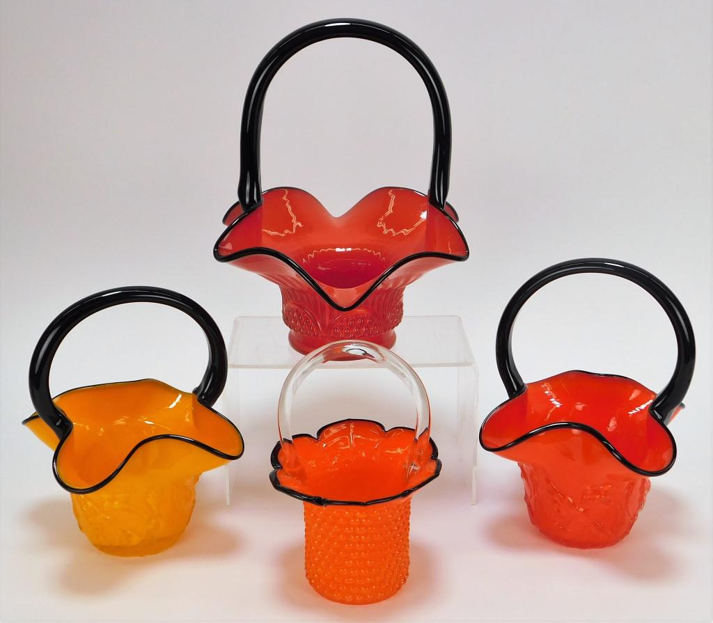 4 Welz Tango Bohemian Art Glass Basket Vases: Bohemia,Early 20th Century Includes one orange vase with applied clear glass handle, one frilled red vase with applied line and dot design, one red vase, and one yellow vase each with matching leaf an
