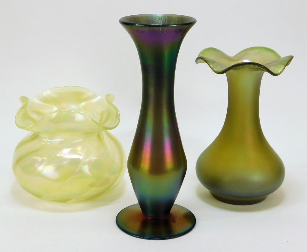 3 Attr. Loetz Iridescent Bohemian Art Glass Vases: Bohemia,Early 20th Century Includes one squat ruffle vase, one ruffled vase with iridescent crackle, and one Jugendstil oil slick vase. Glass,Smallest 6 1/4" x 7 1/4" dia.,Largest 11" x 4 1/2" dia. Fr