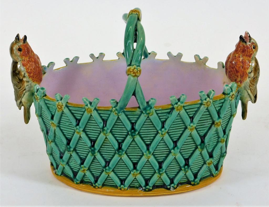Minton English Majolica Robin Bird Basket Vase: England,Late 19th Century Green basket weave posy vase with applied twig handle and two applied robins on each end. Pottery,5 1/4" t x 7 1/4" w x 3 1/4" d, Marked "Mintons" on bottom. From the collect
