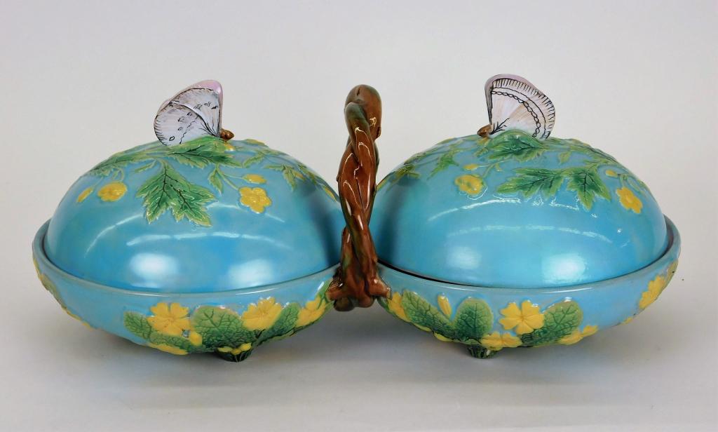 George Jones Majolica Butterfly Compartmented Dish: England,Late 19th Century Two compartmented dish with woven tree branch handle and two lids with Figural Butterfly finials decorated with yellow flowers over a turquoise ground. Pottery,5 1/2" t x 13 