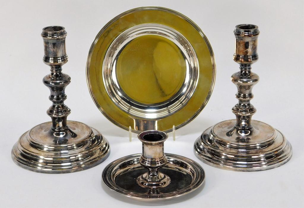 4PC Christofle Silverplate Candlestick Group: France,20th Century Includes a pair of candlesticks with shapely columns, one squat candlestick, and one under tray. Metal,Smallest 2 1/2" x 4 3/4" dia.,Largest 6 1/2" x 5" dia. All marked "Christofle