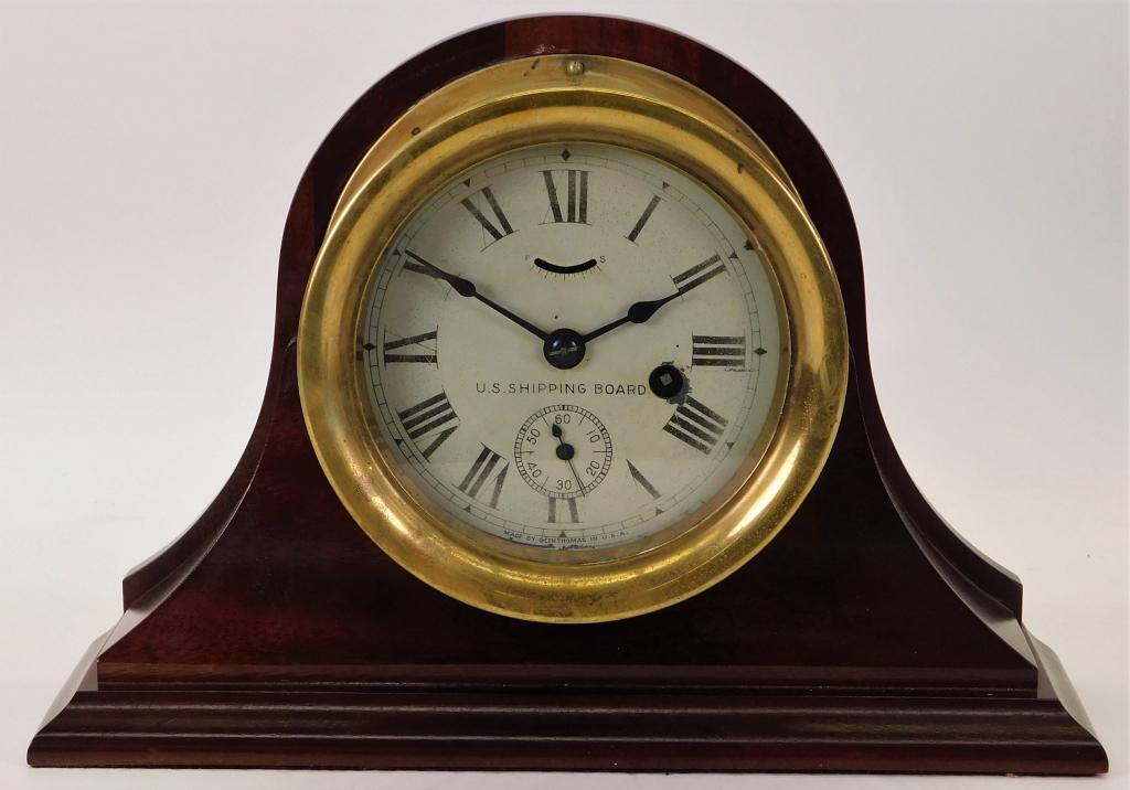 Seth Thomas U.S. Shipping Board Mantel Clock: United States,19th Century Simple form with stepped base and brass detailing, comes with key. Wood, glass, brass,Overall 9 1/2" t x 14" w x 4" d,Clock face 7" dia Marked "Made by Seth Thomas in the US