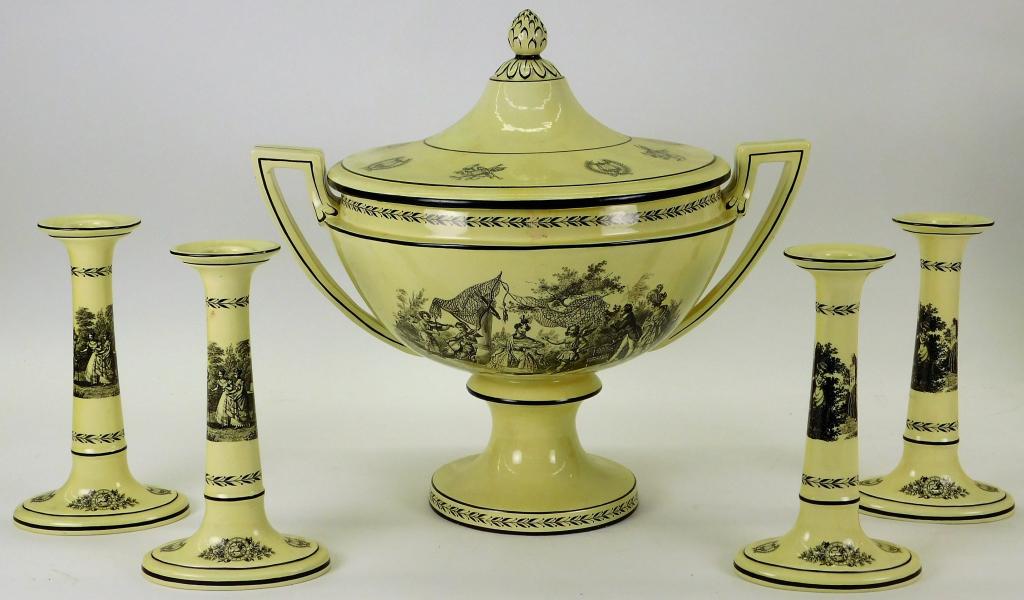 5PC Mottahedeh Italy Neoclassical Porcelain Set: Italy,Early 20th Century Decorated with genre scenes of people in forests across the center of all pieces with lions and harps on feet, includes four candlesticks and one covered center bowl. Porcelai
