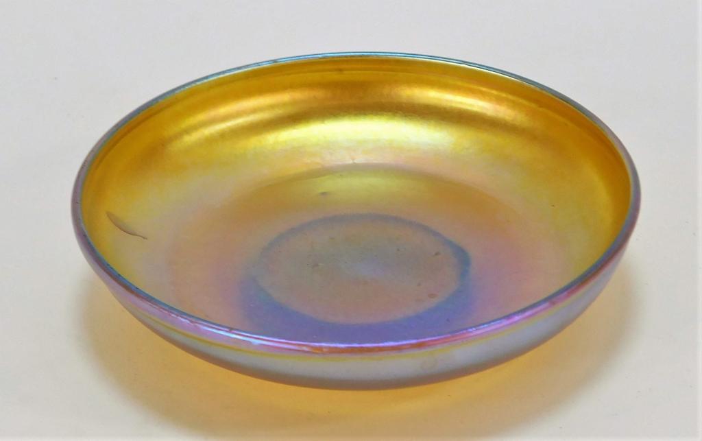 Tiffany Studios Favrile Art Glass Saucer Plate: United States,Early 20th Century Small shallow dish with lovely iridescent gold coloration. Glass,4" dia., Marked "L.C.T. Favrile 1247" on bottom. From the collection of a Pawtucket, Rhode Island lady