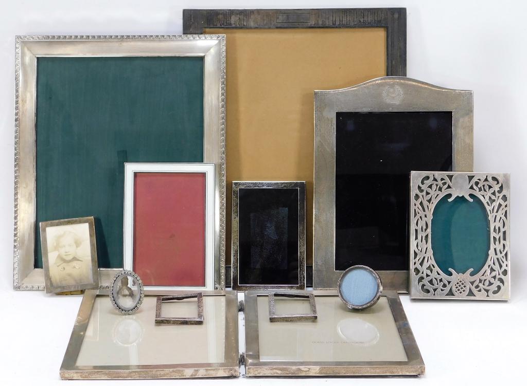 12 Various Silver Picture Frames Grouping: United States,Early 20th Century Includes one small oval frame decorated with rhinestones, one small circular frame, two small simple rectangular frames, a pair of small frames decorated with flowers,