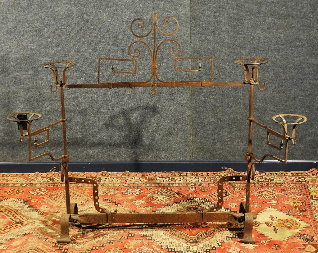 19C American Blacksmith Made Wrought Iron Planter: United States,19th Century Central scrolled basket hanger flanked by swing out arms with acorn finials on a scrolled base. Iron,48" x 36" x 13" deep, From the collection of a Newport, Rhode Island gen