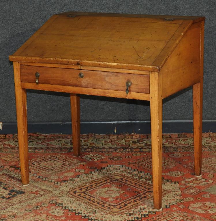 19C. New England Primitive Birch Plantation Desk: New England,19th Century Slant top with fitted interior over one drawer supported by tapered legs, drawer fronts of interior appear to be mahogany. Birch or maple, mahogany secondaries,33" x 31" x 22"