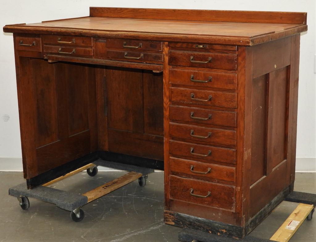 C.1900 Oak Jeweler Watchmaker Workbench: United States,Circa 1900 Rectangular top over thirteen drawers with canvas slide on sturdy paneled legs. Oak,54" x 29" x 38" tall,Table Height 35 1/2" tall From the collection of a Medfield, Massachus