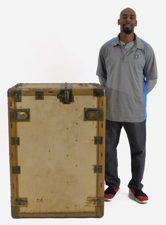 Hartmann Turn Table Pathfinder Garment Trunk: United States,Circa1930 Trunk upholstered in a cream colored leather, one side opens to reveal a section for hanging garments, includes wooden hangers and pant hangers, the other opens to reveal six d