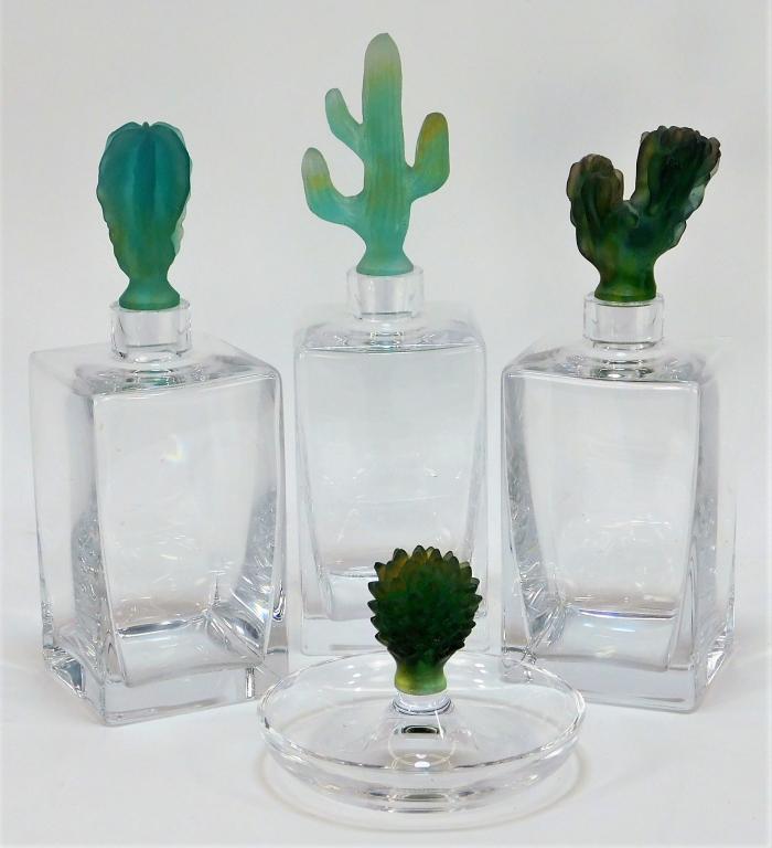 4 Daum France Pate de Verre Cactus Decanter Group: France,20th Century Includes three decanters each with a different type of cacti stopper and one ashtray with a protruding cactus handle in center. Glass,Smallest 4" x 5" dia.,Largest 11 1/2" t x 3 1/