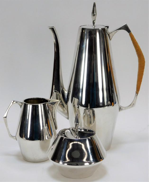 3PC Gio Ponti Reed and Barton Silver Coffee Set: Italy,1891-1979 Includes one creamer, one covered sugar bowl, and one coffee pot with cane wrapped handle in The Diamond pattern. Ponti was an Italian architect and industrial furniture designer best