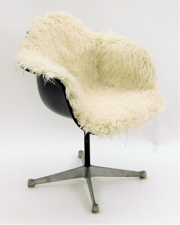Herman Miller Flokati Fur Swivel Office Chair: United States,20th Century Black plastic bucket seat lined with Flokati white fur supported by a simple column ending in four casters. Plastic, metal, wood,32" t x 25" w x 24" d, Marked "Herman Miller
