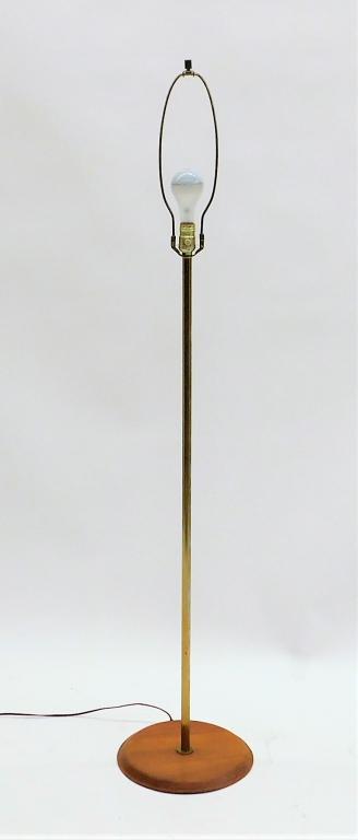 Laurel Lamp Co. MCM 3 Way Bulb Floor Lamp: United States,20th Century Simple brass column supported by a round wood base. Brass, wood,Overall 59 1/4" t x 12" dia., Labeled "Laurel Lamp MFG. CO., Inc." on socket. From the collection of a Provid