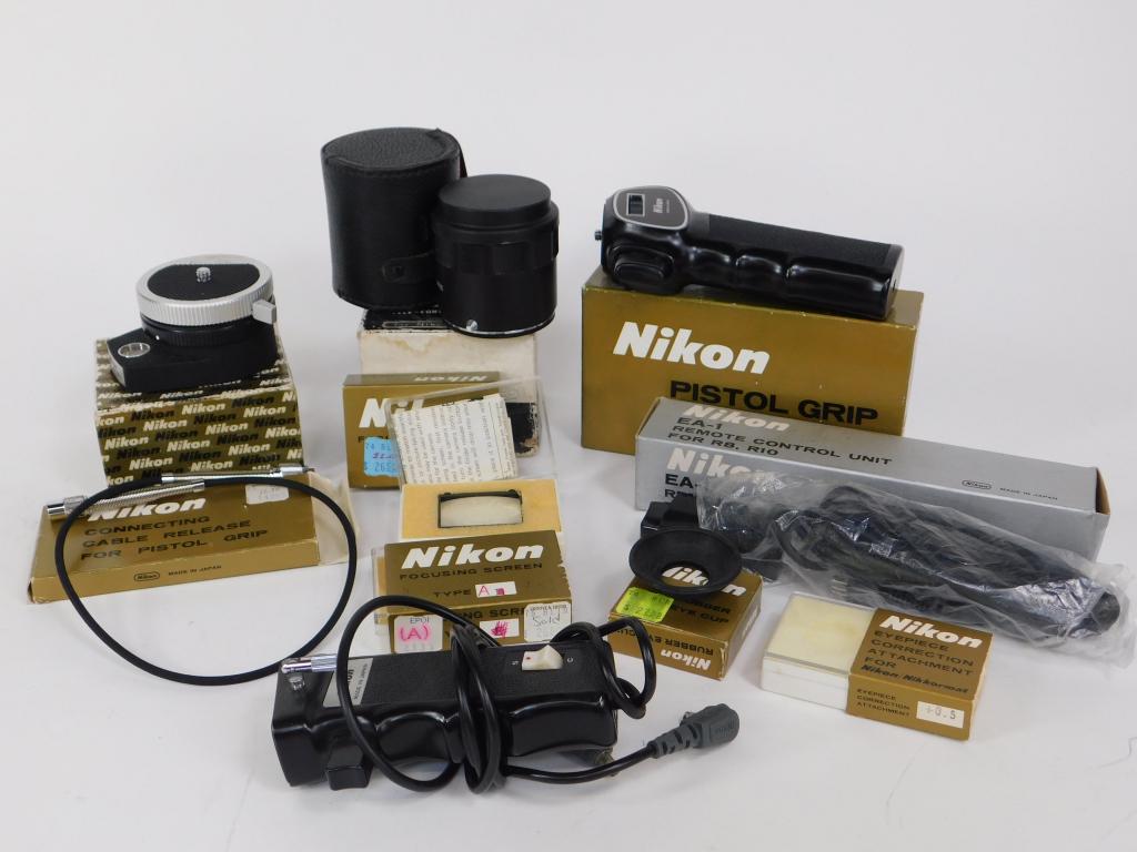 Group of Nikon SLR Accessories: Group of Nikon SLR accessories. Includes pistol grip, remote, cable, teleconverter, panorama head, focusing screes, most in original boxes.