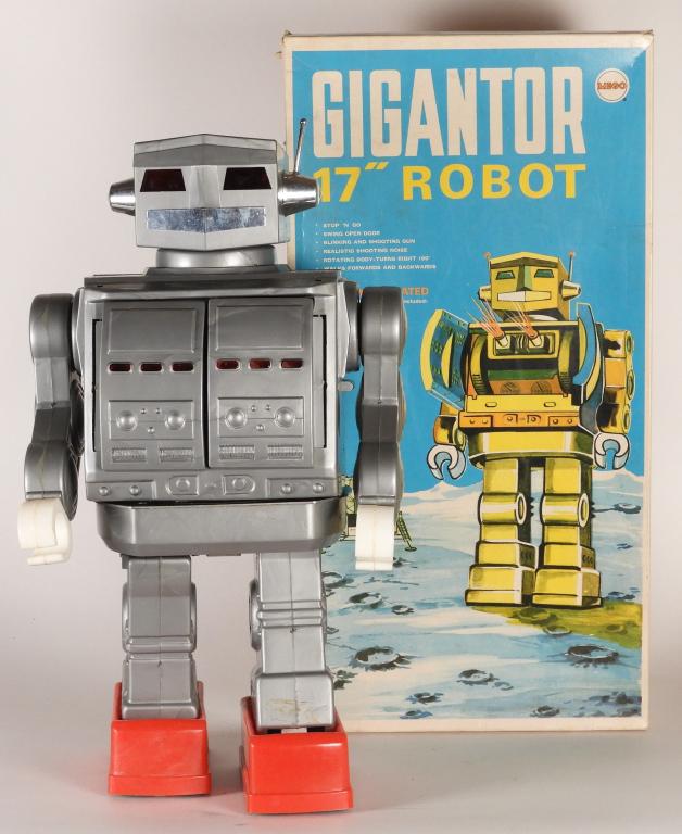 1970 Mego Gigantor 17" Battery Op. Robot Toy: Hong Kong,1970 Box C7.5+ with light shelf wear, light crushing to surface, corner and edge wear, small pinhole puncture left side, tear to bottom flap, vibrant colors and displays beautifully. Toy C7+