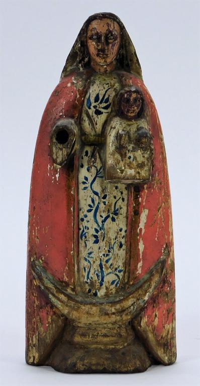 South American Madonna and Child Santos Statue: South America,Late 19th-Early 20th Folk art figure of the Virgin Mary decorated with glass eyes and dressed in a red cape and blue floral dress holding baby Jesus. 10 1/4" x 4 1/2",, Wood, glass From
