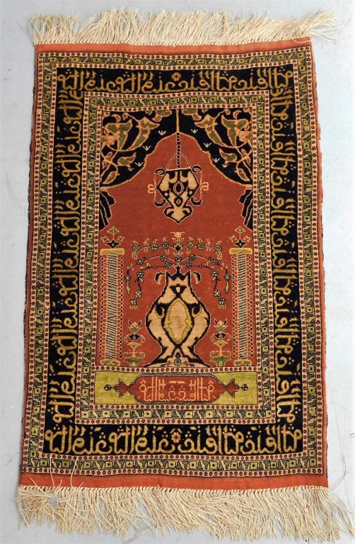 Middle Eastern Red and Blue Silk Prayer Rug: Middle East,20th Century Red colored field with Arabic calligraphy and geometric borders throughout. 35 3/4" x 23 1/4",, Silk From the collection of a Warwick, Rhode Island gentleman.