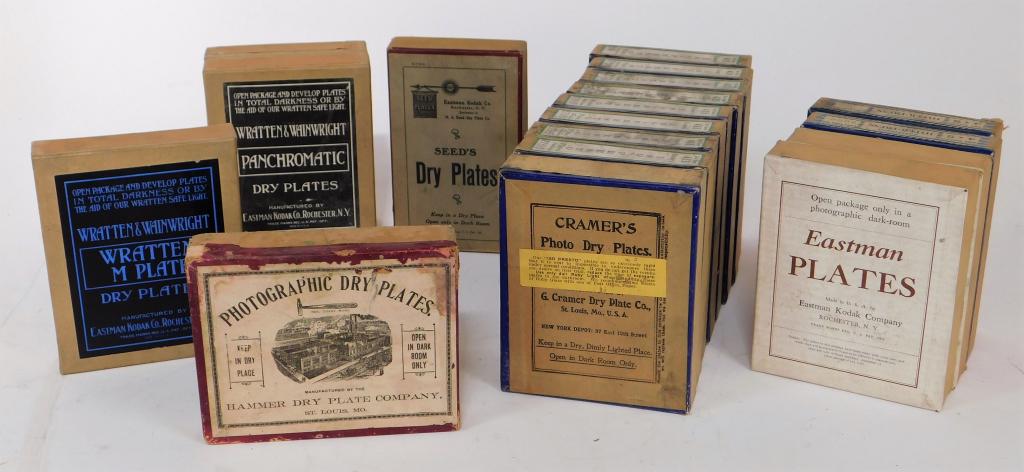 Lot of 18 Boxes of Glass Dry Plates: Lot of 18 boxes of glass dry plates, mostly unopened. Includes Hammer Dry Plate Co, 1 Seeds, 4 Eastman, 3 Wratten & Wainwright, 9 Cramers, wear and loss to some boxes, most with dirt on tops, one open