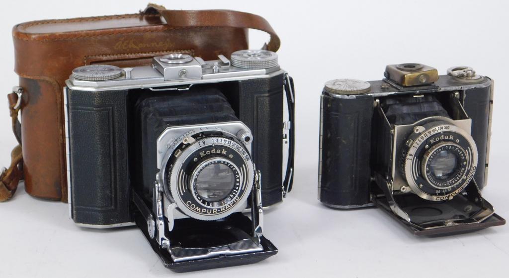Lot of 2 German Kodak Folding Cameras: Lot of 2 German Kodak front folding cameras. Includes Kodak Duo Six-20, Kodak Anastigmat 75mm f/3.5 lens with leather case, and Vollenda 48 with Schneider Radionar 50mm f/3.5.